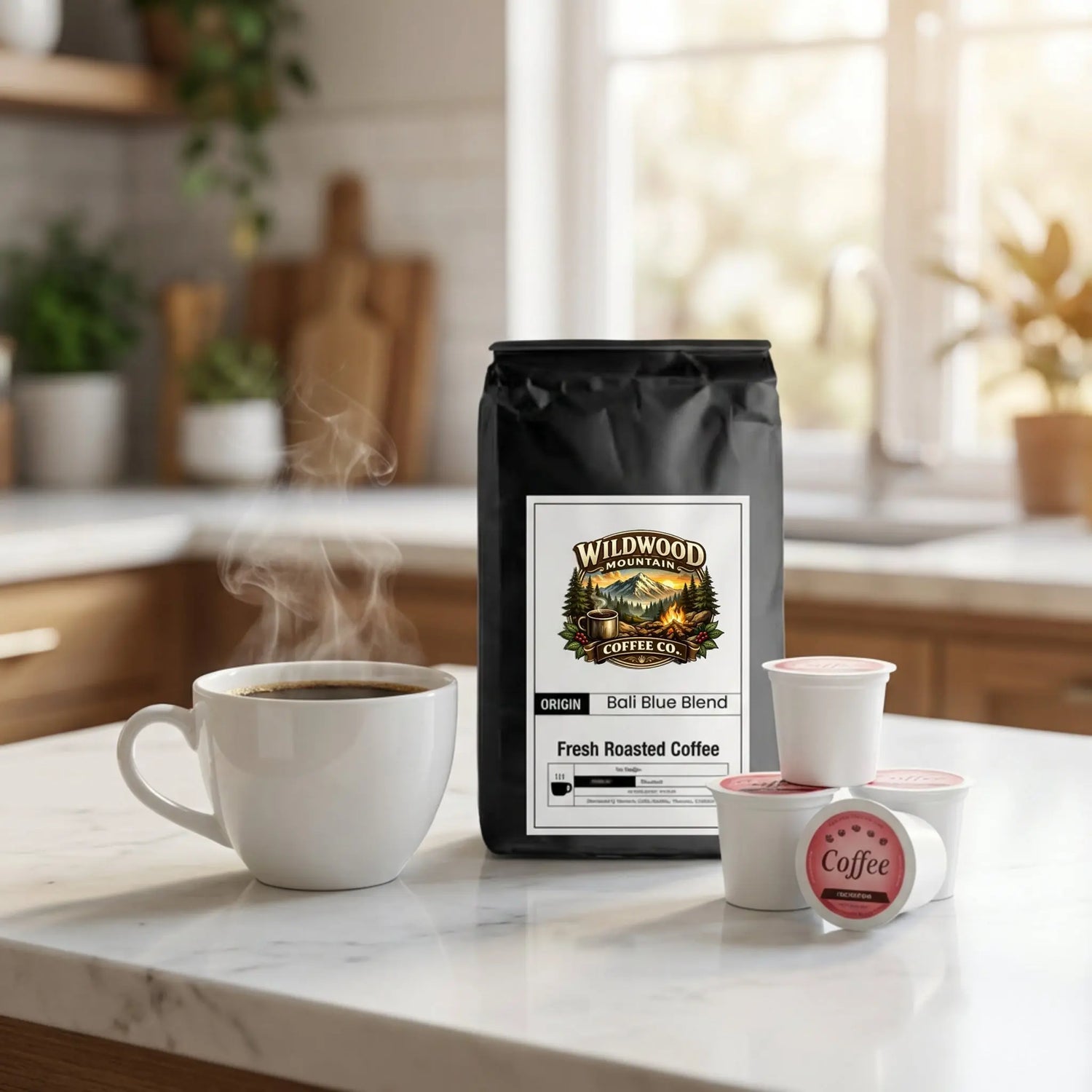 Wildwood Mountain Coffee Co. bag on a marble kitchen counter with coffee and coffee pods