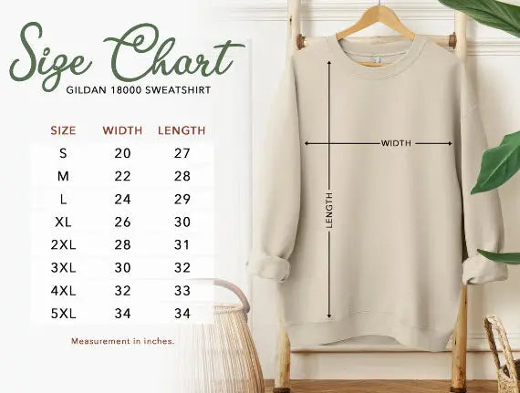 Beige sweatshirt on a hanger with size chart on the left
