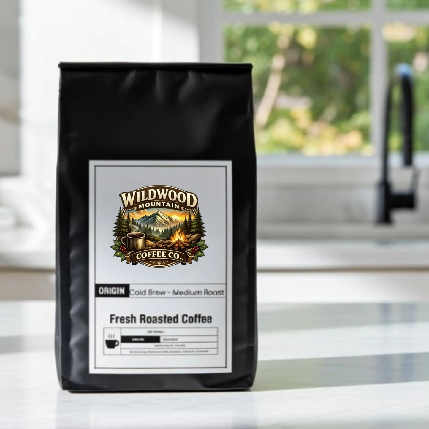 Coffee bag from Wildwood Mountain Coffee Co. on a kitchen counter with a blurred background