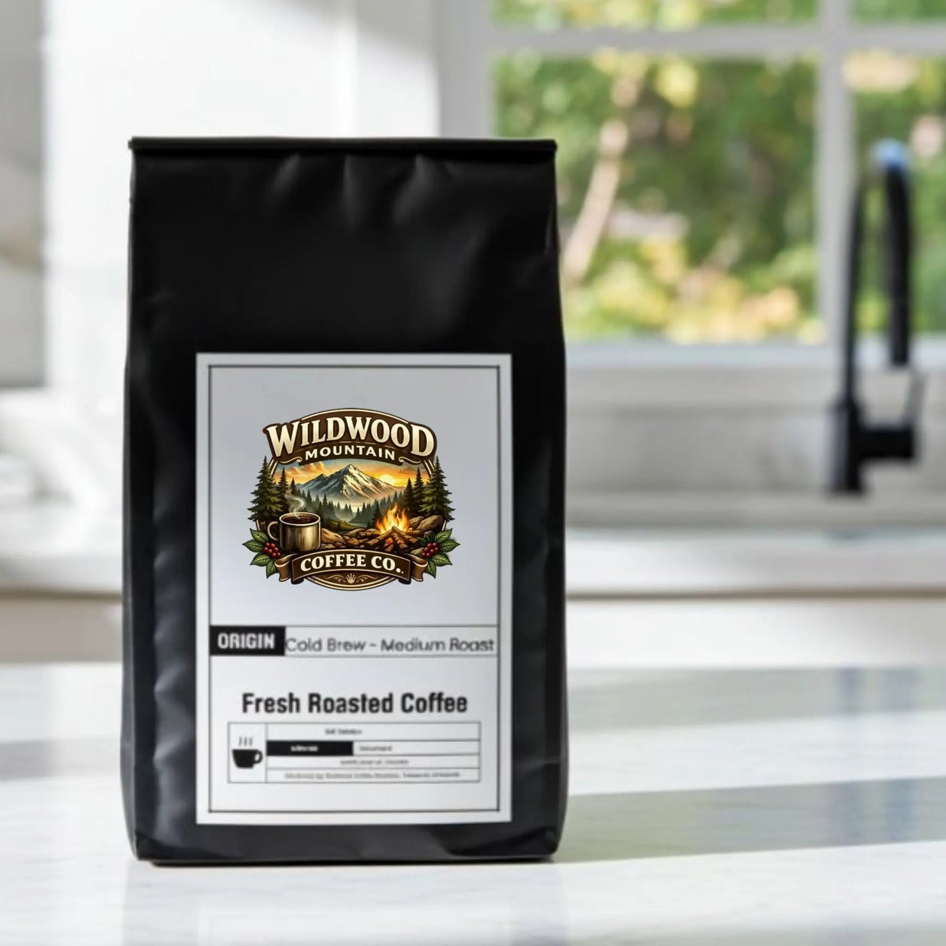 Coffee bag from Wildwood Mountain Coffee Co. on a kitchen counter with a blurred background