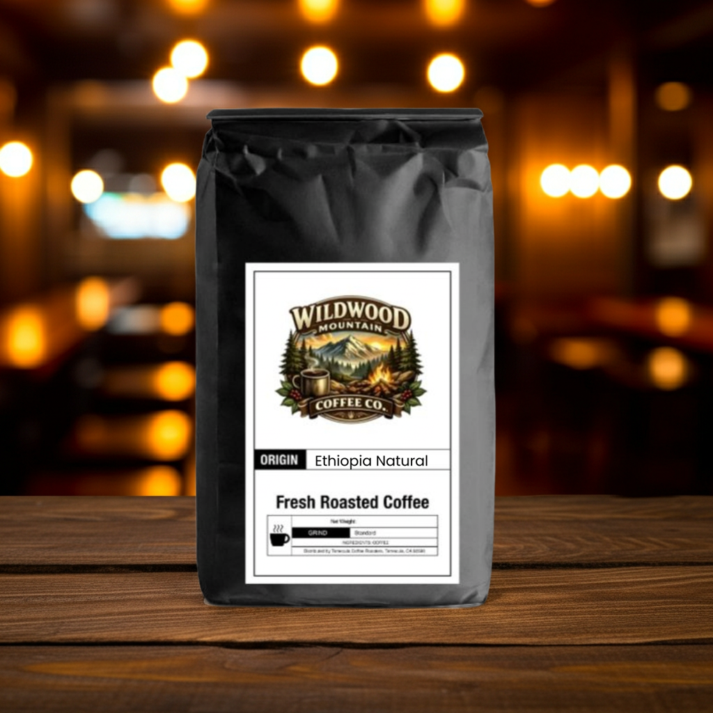 Coffee bag from Wildwood Mountain Coffee Co. on a wooden surface with blurred lights in the background