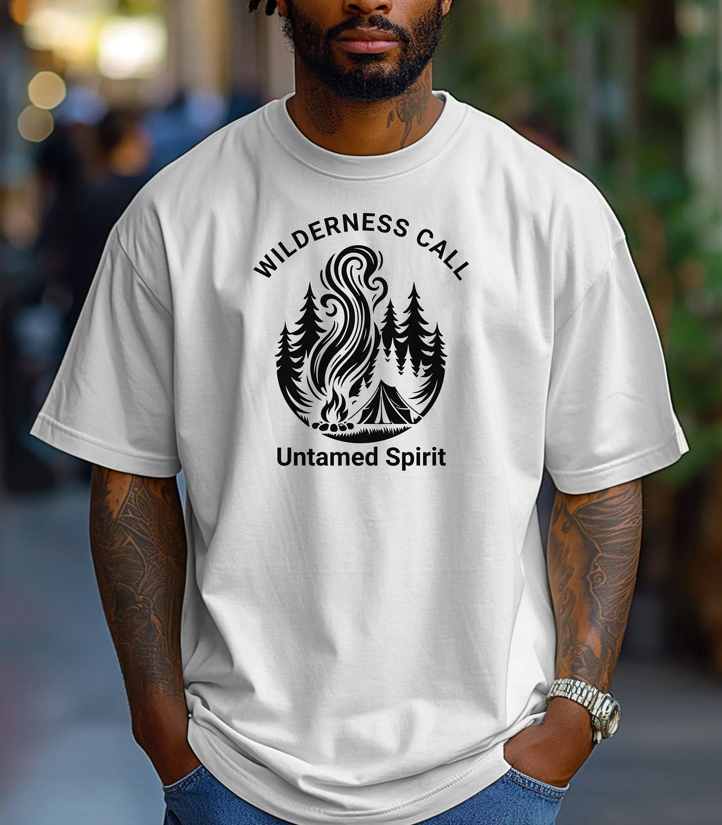 Person wearing a white t-shirt with wilderness call untamed spirit design and text.